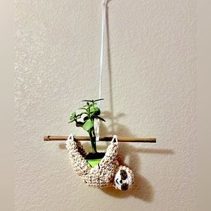 Sloth planter hanging from a bamboo stick crochet pattern